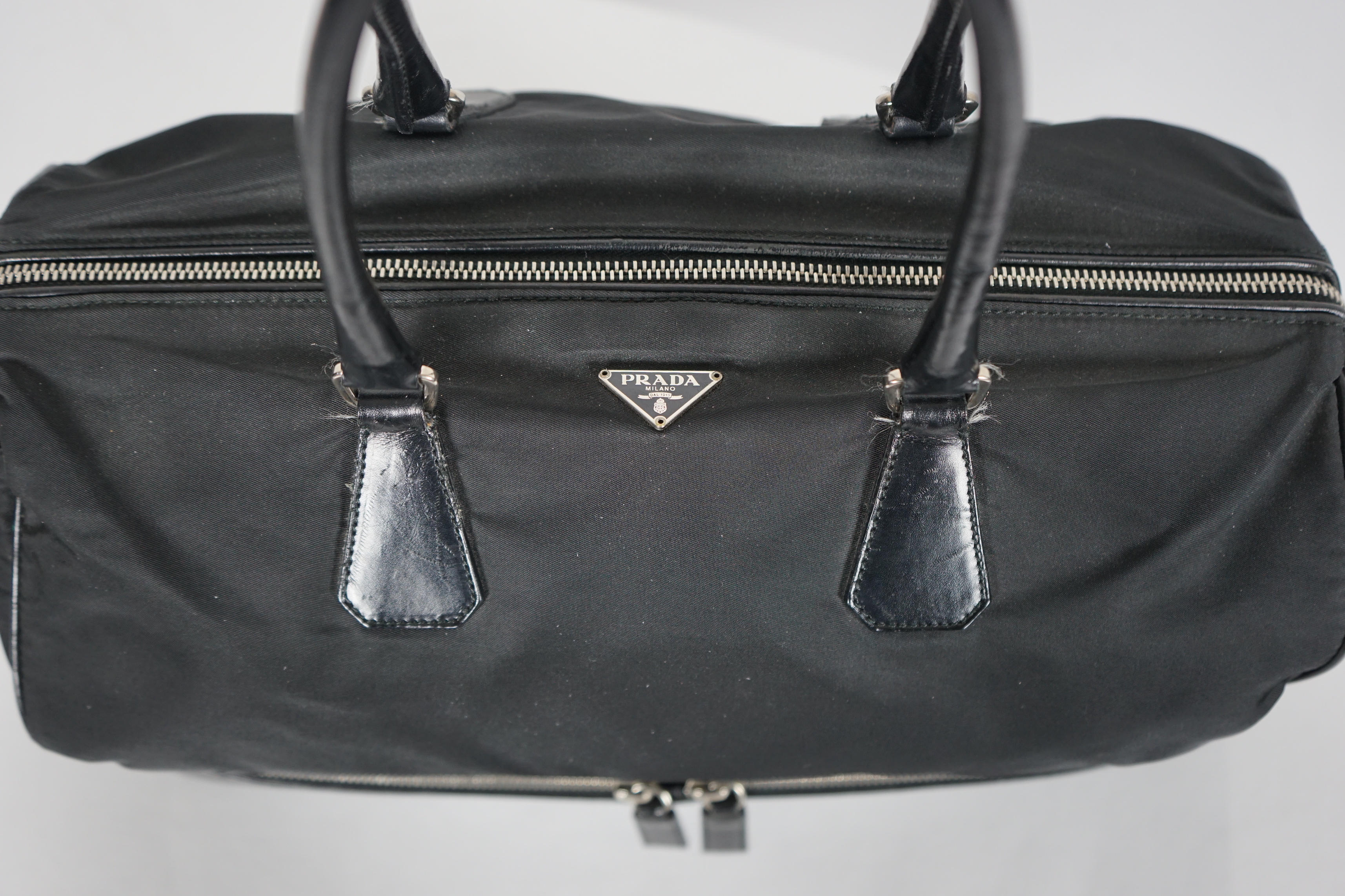 A Prada Tessuto black nylon and leather bag, width 38cm, height 23cm, depth 50cm